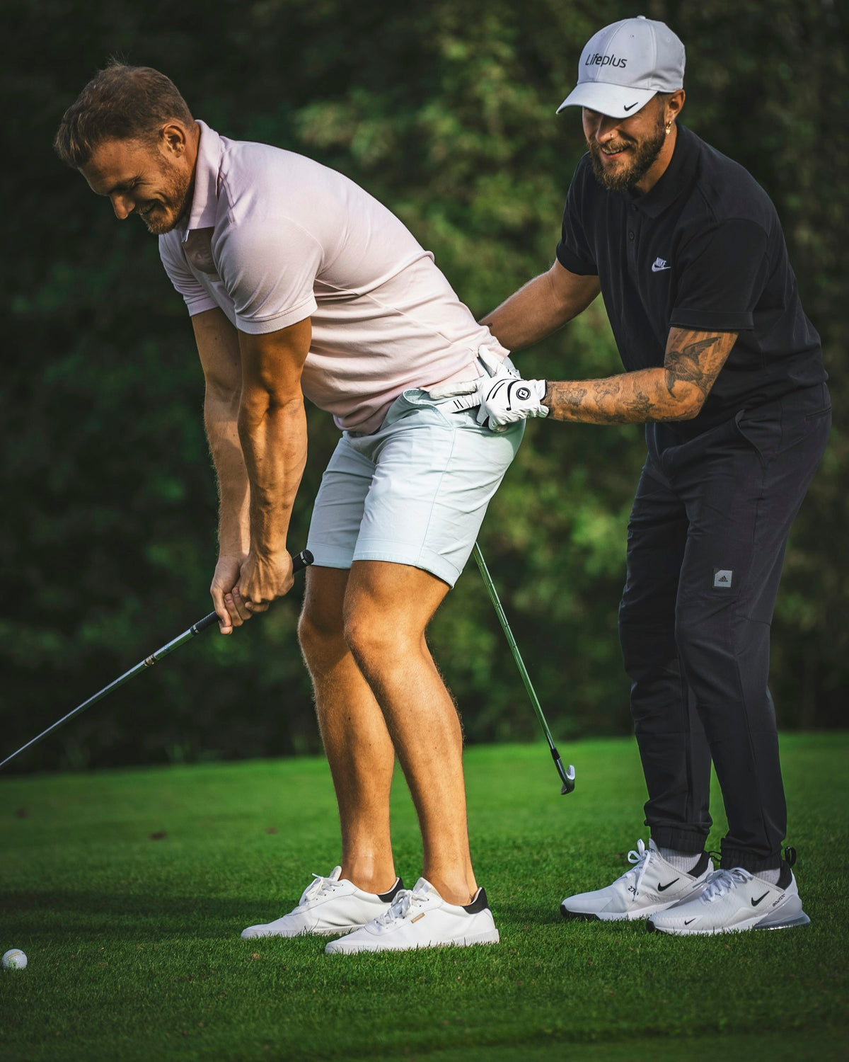 Golf coach guiding a player's grip on the course