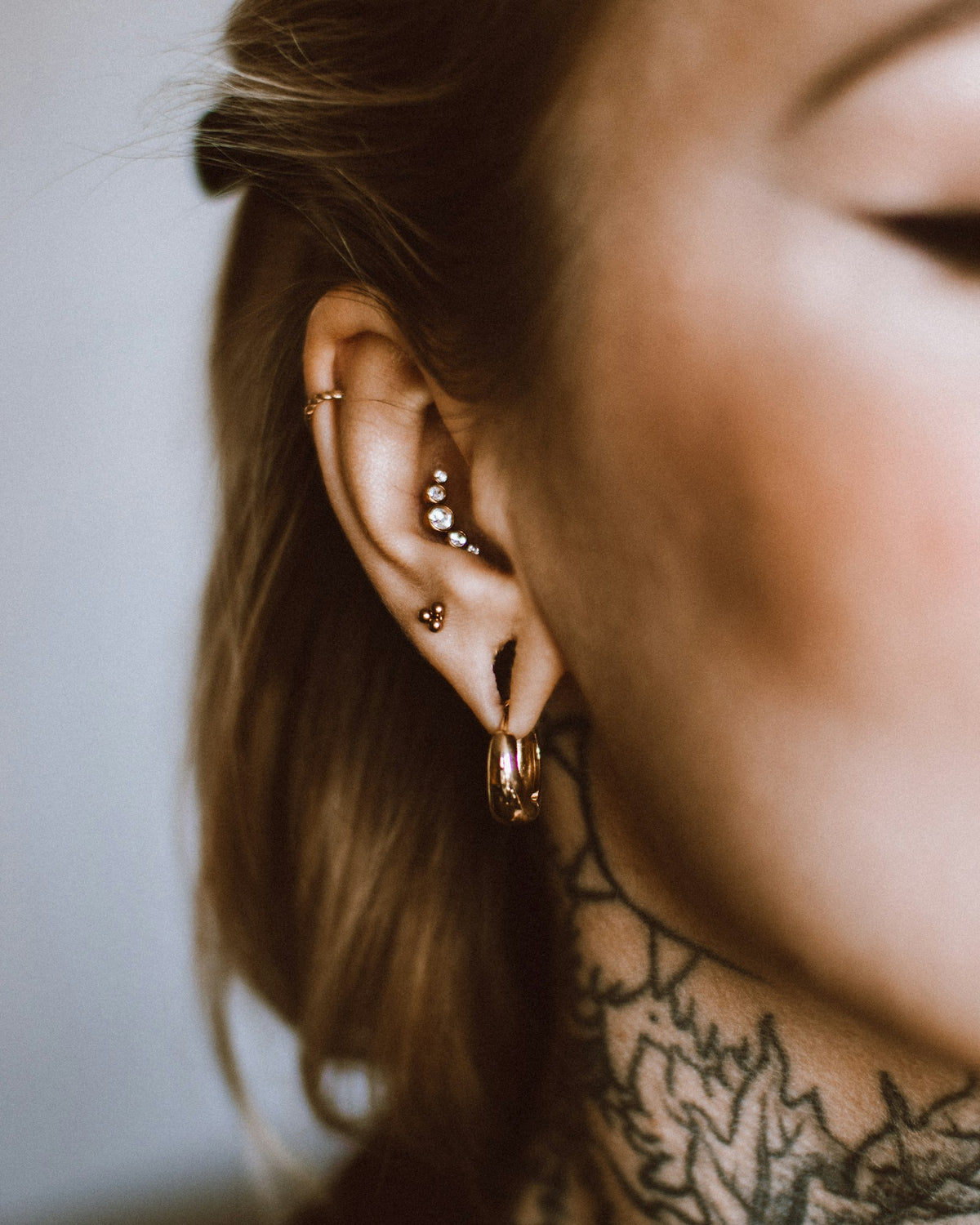 Woman with several ear piercings